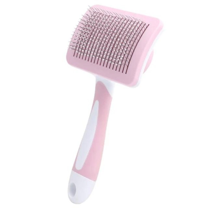 Une brosse pour chat rose